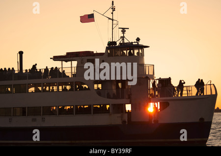 USA, New York City, Silhouette of passengers on tourboat Stock Photo