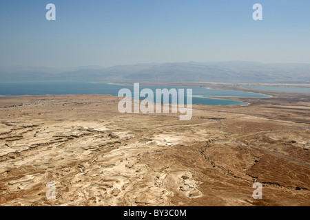 A westward view of the Dead Sea, Israel as seen from Masada National Park. Foreground is the Judean Desert. Mountains in the dis Stock Photo