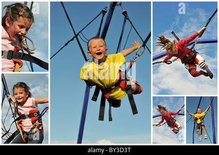 Little children jumping on the trampoline (bungee jumping). Stock Photo