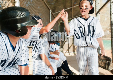 USA, California, Ladera Ranch, Boys (10-11) from little league sitting on dugout Stock Photo