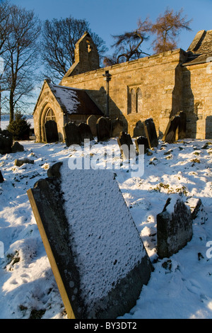 Graveyard of St Mary Magdalene Church in Winter near Over Silton Village North Yorkshire England Stock Photo