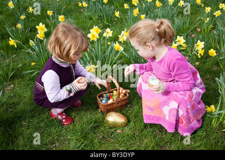 Girls on an Easter egg hunt in Lancashire, UK. Stock Photo
