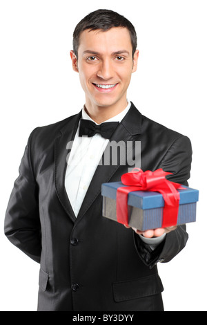 https://l450v.alamy.com/450v/by3dyy/a-smiling-man-in-black-suit-and-bow-tie-giving-a-gift-by3dyy.jpg