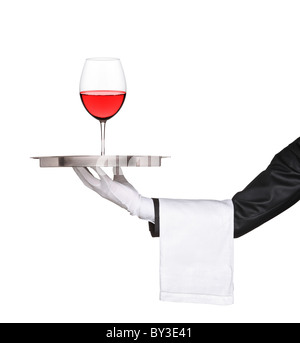 Hand holding a silver tray with a glass of wine on it Stock Photo