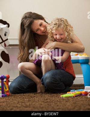 USA, Utah, Lehi, mother embracing daughter (2-3) Stock Photo