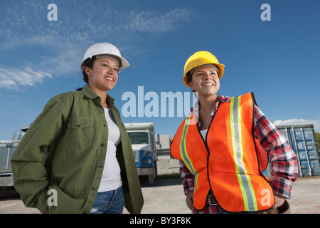 Portrait of two female construction workers on building site Stock Photo