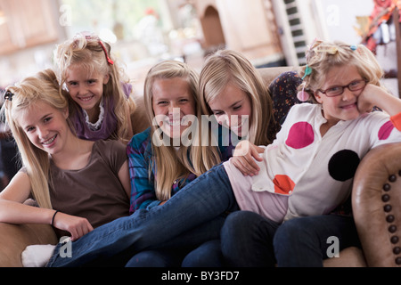 USA, Utah, family portrait of sisters on sofa (6-7, 8-9, 12-13, 14-15, 16-17) Stock Photo