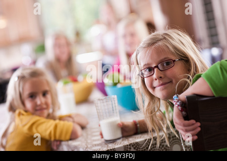 USA, Utah, family portrait of sisters (6-7, 8-9, 12-13, 14-15, 16-17) at table Stock Photo