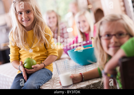 USA, Utah, family portrait of sisters (6-7, 8-9, 12-13, 14-15, 16-17) at table Stock Photo