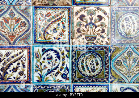 A collection of colourful Damascus ceramic square tiles on a wall in a home in the old city of Damascus, Syria. Stock Photo