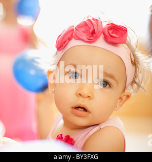 Portrait of girl (2-3) wearing headband with roses Stock Photo