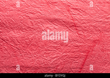Image texture of crumpled ped paper. Stock Photo