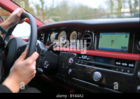 Interior showing dashboard and steering wheel of Rolls Royce Ghost UK Stock Photo
