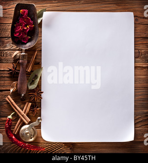 https://l450v.alamy.com/450v/by45th/image-of-white-paper-with-spices-on-a-wooden-surface-by45th.jpg