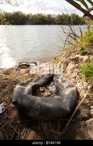 Trash-strewn path from the Rio Grande River, the border between the ...