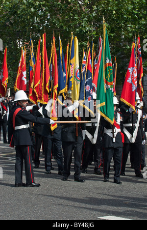 March master leads march from Smithfield EC1 National firefighters memorial Service of remembrance Flags different fire brigades Stock Photo