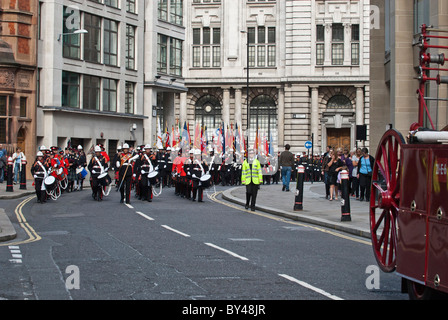 March master leads Fire brigade band National firefighters memorial Service of remembrance crossing Warwick Street EC4 London . Stock Photo