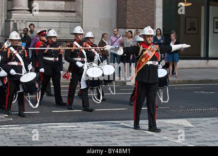 March master leads Fire brigade band National firefighters memorial Service of remembrance crossing Newgate Street EC1 London . Stock Photo