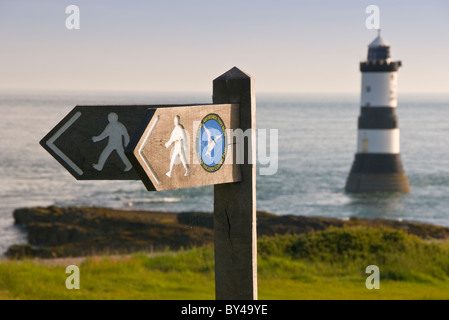 Isle of Anglesey Coastal Path Sign & Penmon Lighthouse, Penmon Point, Anglesey, North Wales, UK Stock Photo