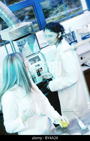 Scientists testing in university chemical laboratory. Stock Photo