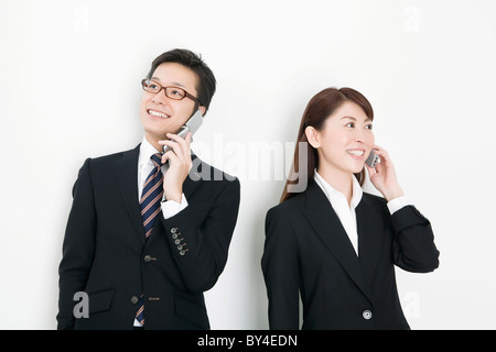 Businesspeople on cell phone Stock Photo
