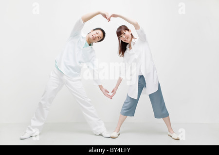 Young couple making a heart shape Stock Photo