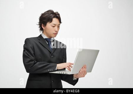 Businessman using a laptop Stock Photo
