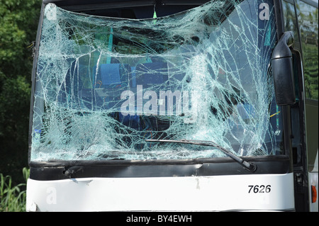 Wrecked bus with shattered windscreen glass Stock Photo
