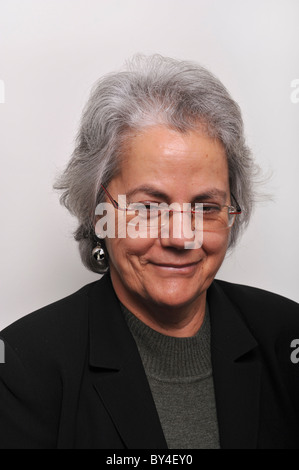Portrait of a happy middle aged woman smiling with glasses looking at camera Stock Photo