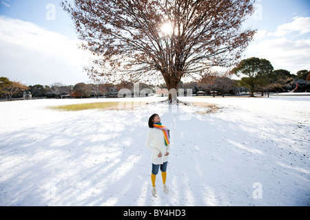 Teenage Girl Standing Near Tree Stock Photo