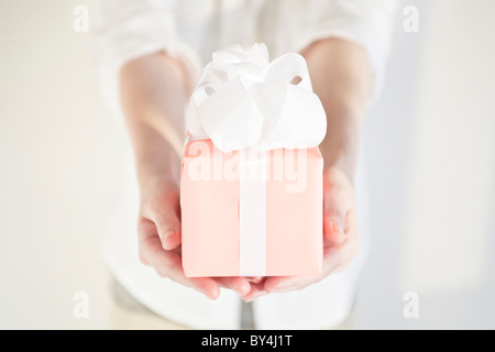Woman holding a present Stock Photo