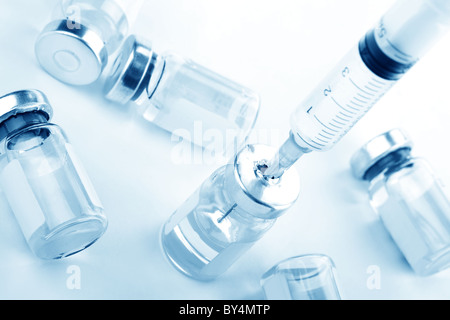 Closeup of Syringe and Vaccination,Toned Blue. Stock Photo
