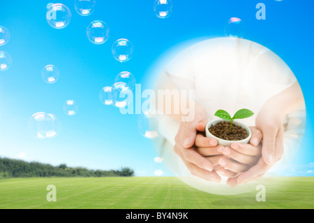 Mother and Child Holding Sprout Stock Photo