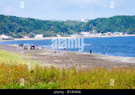 Fishing on Beach Stock Photo