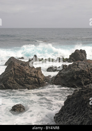 Sea breaking on volcanic rocks, Puerto de la Cruz, Tenerife, Islas Canarias (Canary Islands), Spain. Stock Photo