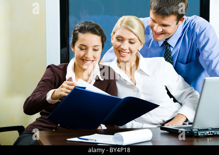 Group of three business people working together in the office Stock Photo