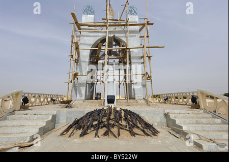 'Flame of Peace' Monument (commemorating the end of the Tuareg rebellion in 1996). under repair. Timbuktu, Mali. Stock Photo