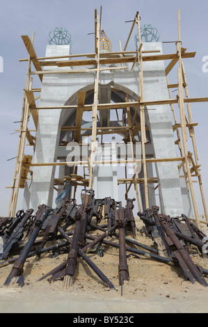'Flame of Peace' Monument (commemorating the end of the Tuareg rebellion in 1996). under repair. Timbuktu, Mali. Stock Photo