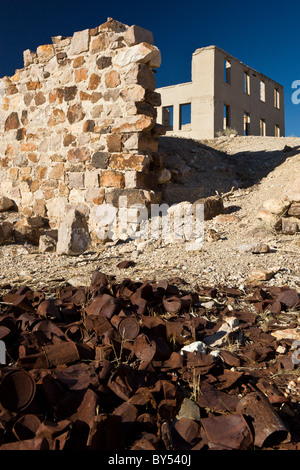 Ruins of stone foundation and Cook Bank building in the ghost town of Rhyolite, Nevada founded in 1905 and abandoned by 1920. Stock Photo