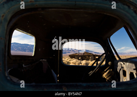 Ballarat ghost town ruins framed by window of Manson family member 'Tex' Watson's 1942 Dodge Power Wagon near Death Valley, California, USA. Stock Photo