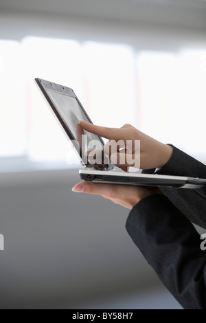 Woman's hand holding tablet computer Stock Photo