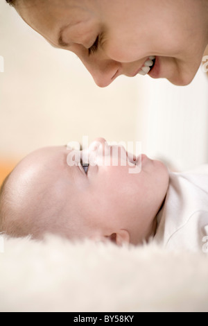 A mother and her baby boy, close-up, face to face Stock Photo
