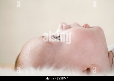 A baby looking up Stock Photo