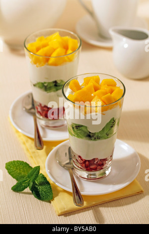 Yogurt with tropical fruits. Recipe available. Stock Photo