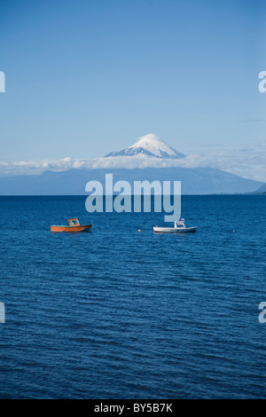 View of boats on Lake Llanquihue and Osorno Volcano, Puerto Varas, Chile Stock Photo