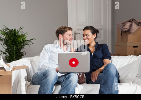 A couple taking a break from moving Stock Photo