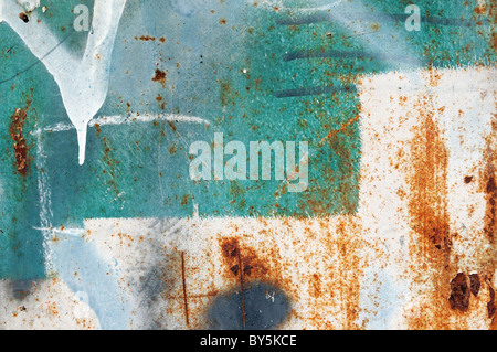 Messy paint stains on rusty metal. Grungy background texture. Stock Photo