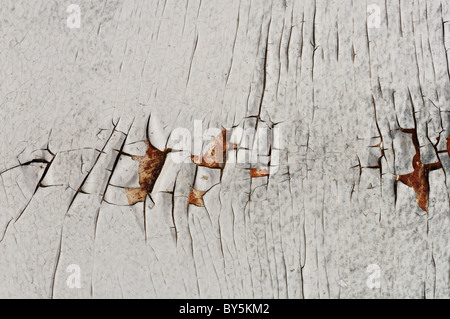 White cracked peeling paint grungy background texture. Stock Photo