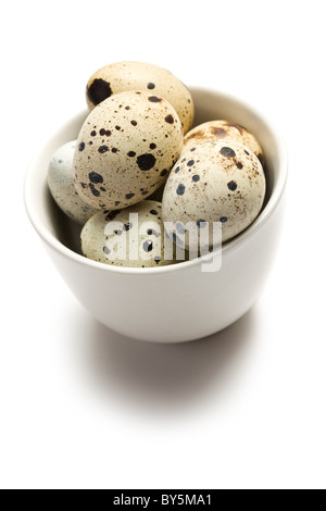 the quail eggs in bowl on white background Stock Photo