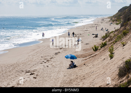 Sunbathers and beach walkers on Nauset Light Beach in Eastham, Massachusetts Stock Photo